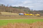212 256-2 von Regental Bahnbetriebs GmbH NBE mit DB Gleisstopfmaschine 09-32 CSM von Plasser & Theurer und Universalplaniermaschine USP 2000 SWS bei Urspring am 21.11.2009.